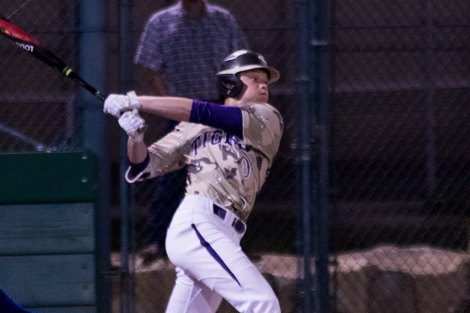 Lemoore's Jared Holaday shown here belting a fourth-inning triple to help lead his Tigers to a 2-0 win over Hanford West on March 23.